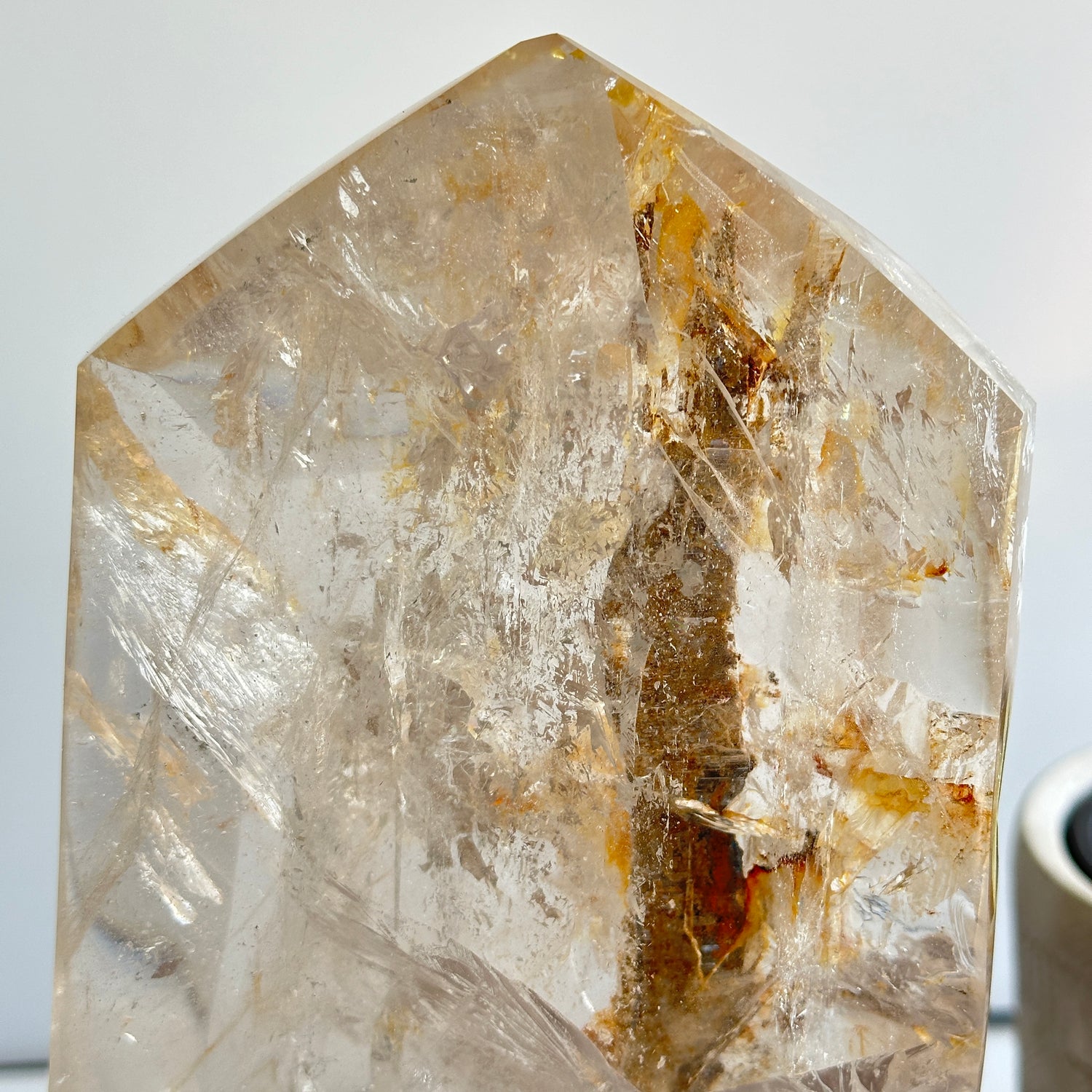 Clear Quartz With Iron Inclusions Point In Stand 26cm