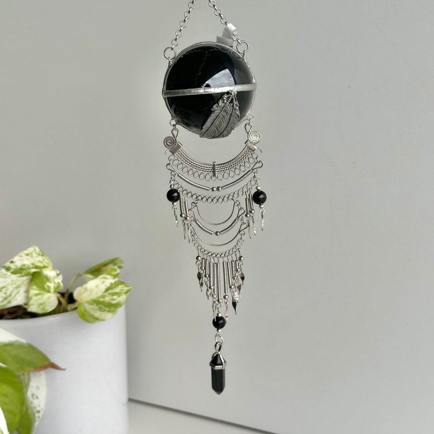 Black Obsidian Sphere Hanging Feathers