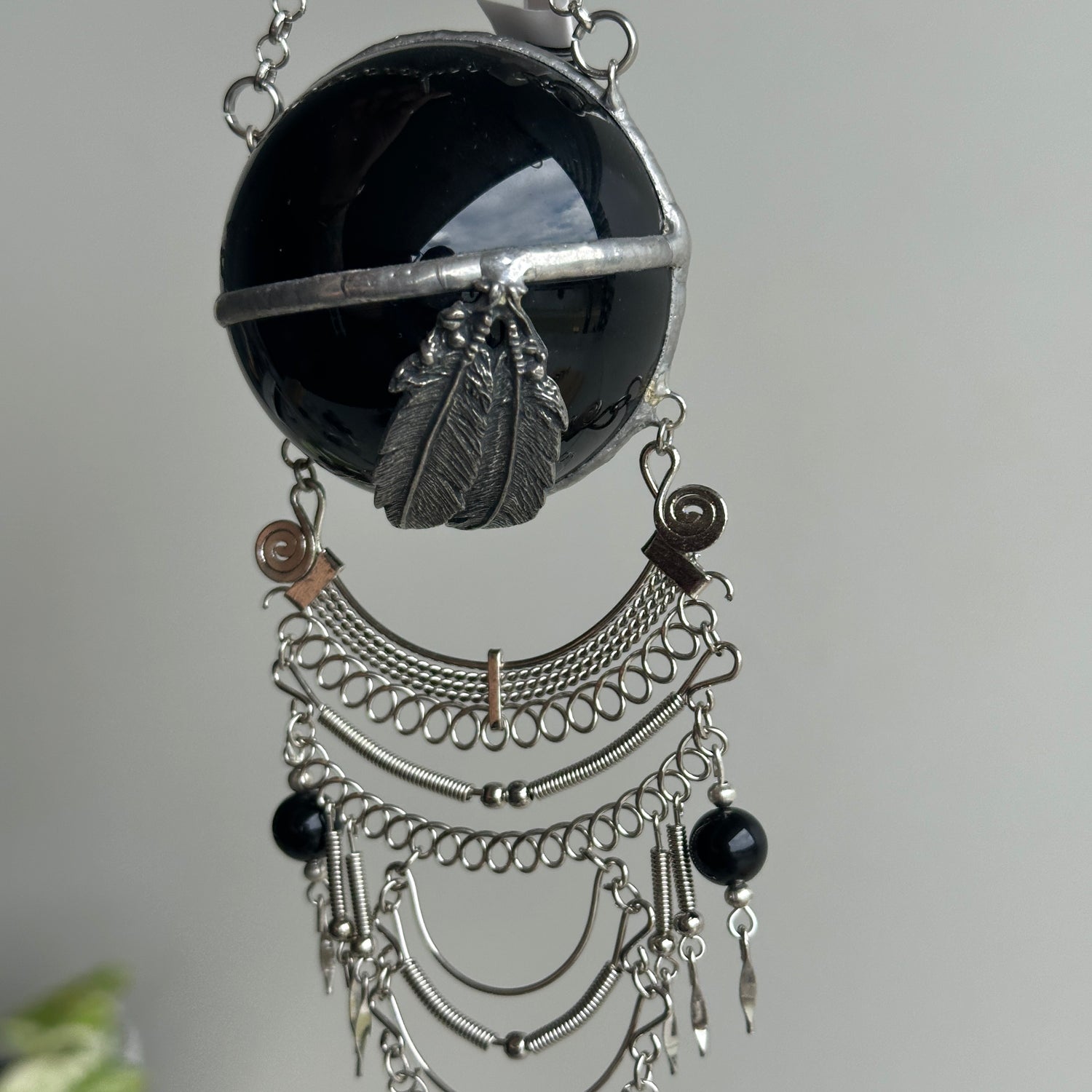Black Obsidian Sphere Hanging Feathers