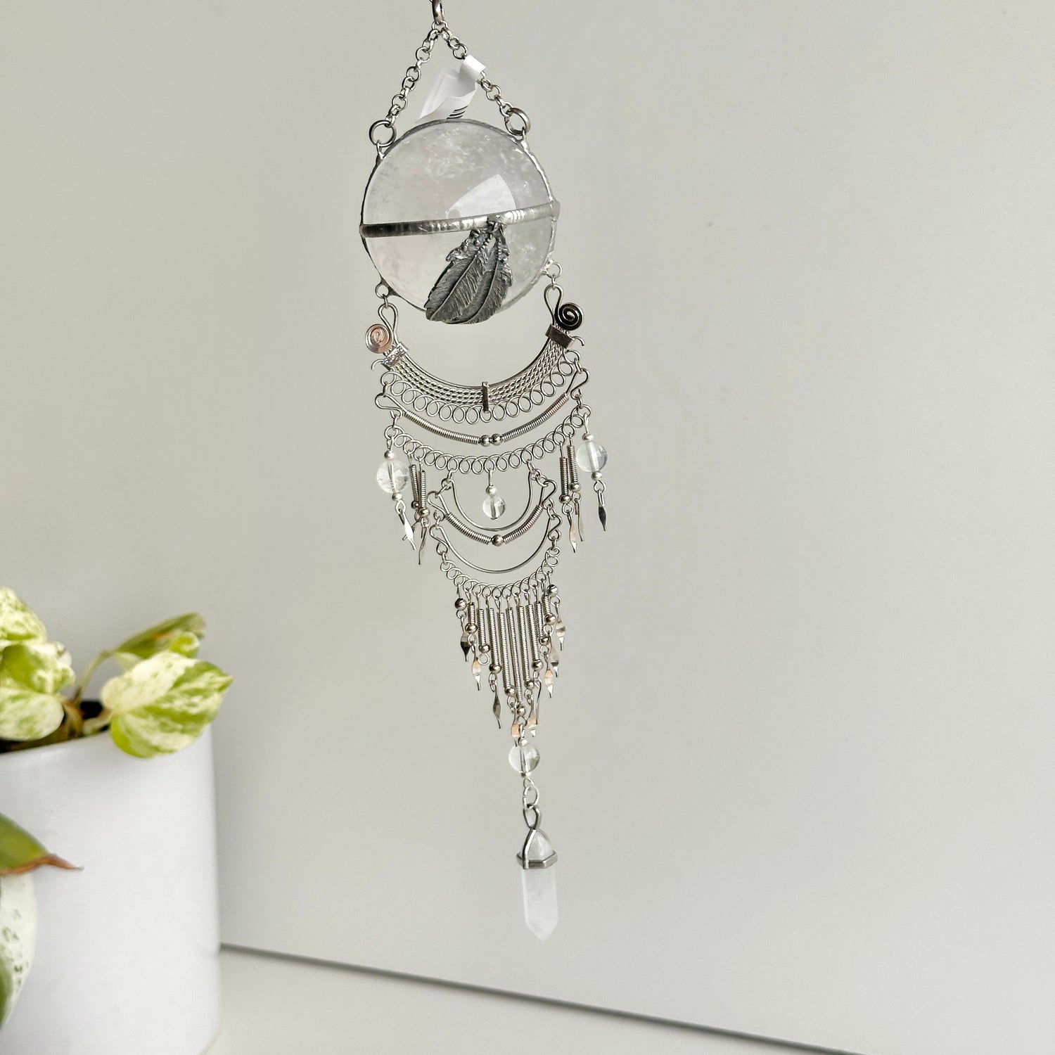 Clear Quartz Sphere Hanging Feathers