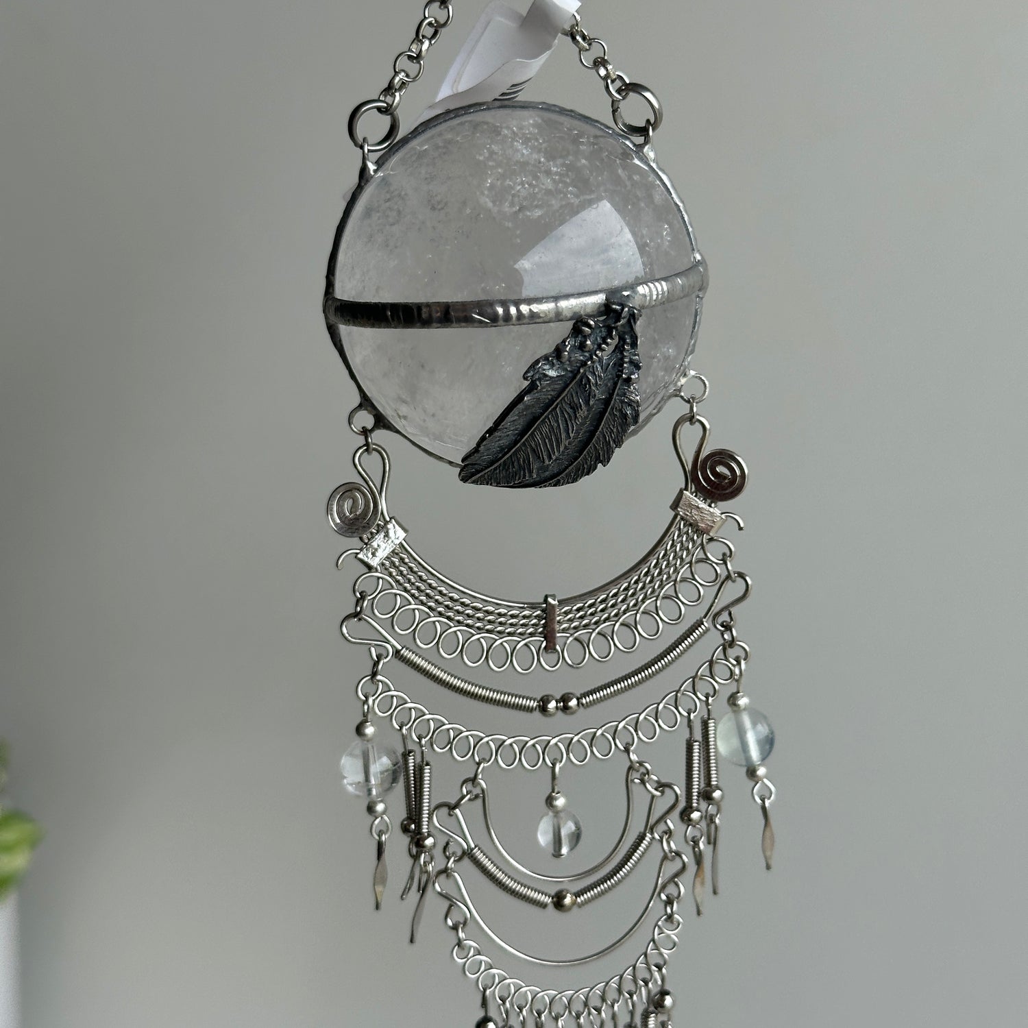 Clear Quartz Sphere Hanging Feathers