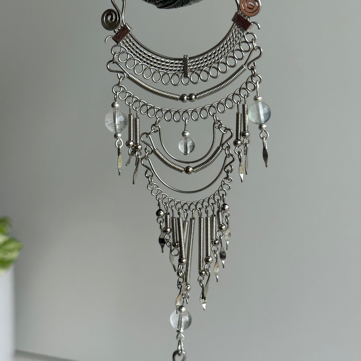 Clear Quartz Sphere Hanging Feathers